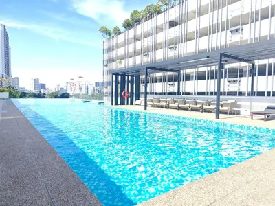 a large swimming pool in front of a building at 02 Kuala Lumpur KL Mid Valley The Garden 9Seputeh Vivo Soho 4PAX in Kuala Lumpur