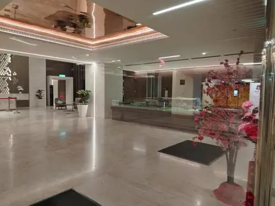 a lobby with a flower arrangement in the middle of a building at NEO Quill Residences klcc in Kuala Lumpur