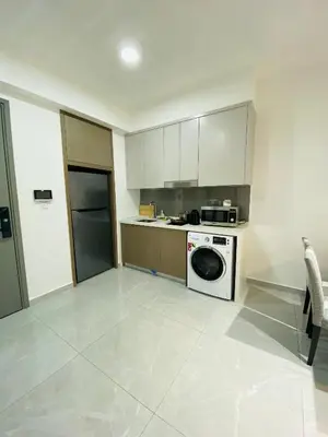 a kitchen with a washer and a dishwasher at Bukit Bintang Suites KLCC by YBS in Kuala Lumpur