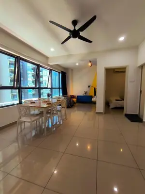 a living room with a table and a ceiling fan at 10 Mins to KLCC Cozy Place to Stay in Kuala Lumpur