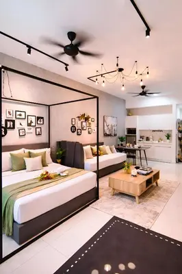 a bedroom with two beds and a living room at Future Star Chamber Residence in Kuala Lumpur