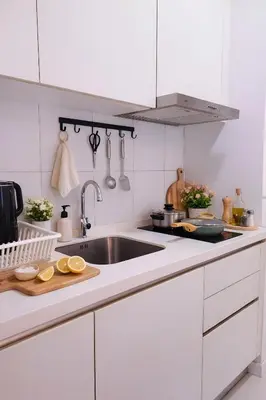 a kitchen with white cabinets and a sink at Future Star Chamber Residence in Kuala Lumpur