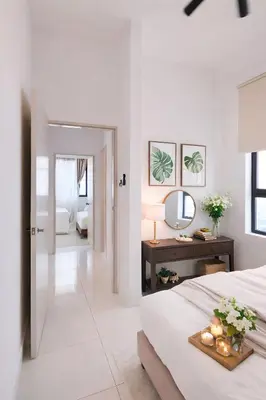 a white bedroom with a bed and a table with a mirror at Future Star Chamber Residence in Kuala Lumpur
