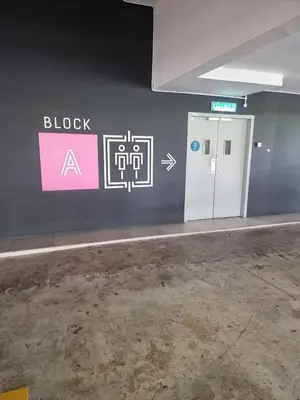 a room with a wall with a block sign and a door at Awani3 Homestay, Setapak, KL in Kuala Lumpur