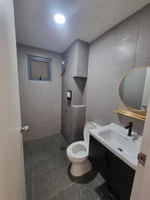 a bathroom with a toilet and a sink and a mirror at Awani3 Homestay, Setapak, KL in Kuala Lumpur