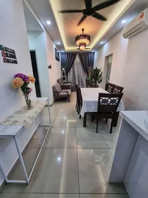 a living room with a dining room table and chairs at Awani3 Homestay, Setapak, KL in Kuala Lumpur