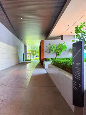 a hallway in a building with trees and plants at Luxury Axon Residence Bukit Bintang KLCC Pavilion By EQZ in Kuala Lumpur