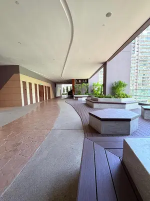 a lobby with benches and tables in a building at Luxury Axon Residence Bukit Bintang KLCC Pavilion By EQZ in Kuala Lumpur