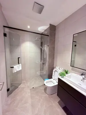 a bathroom with a shower and a toilet and a sink at Luxury Axon Residence Bukit Bintang KLCC Pavilion By EQZ in Kuala Lumpur