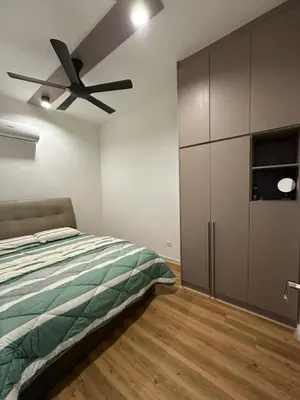 a bedroom with a bed and a ceiling fan at Staycay Majestic Residence KL in Kuala Lumpur