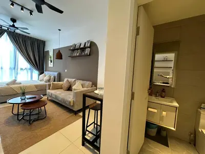 a living room with a couch and a table at LA Majestic Suites at KlCC in Kuala Lumpur