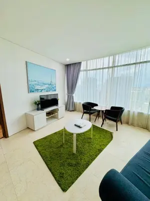 a living room with a couch and a table at Apartment Kuala Lumpur City 3 Minutes To KLCC in Kuala Lumpur