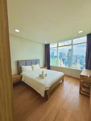 a bedroom with a bed and a large window at Apartment Kuala Lumpur City 3 Minutes To KLCC in Kuala Lumpur