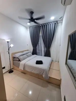 a bedroom with a bed and a ceiling fan at Awani3 Homestay Setapak, KL in Kuala Lumpur