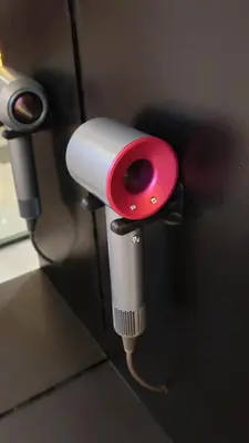 a red and white pipe sticking out of a wall at pertama residency jacuzzi projector 120