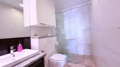 a bathroom with a shower and a toilet and a sink at Platinum Kuala Lumpur By NewMoon in Kuala Lumpur