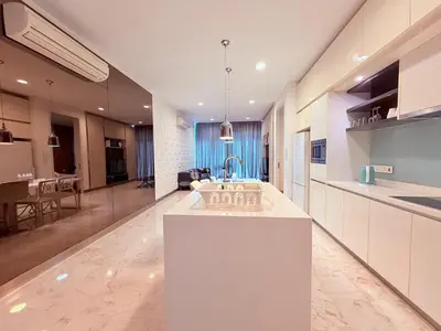 a kitchen with a white island in a room at Platinum Kuala Lumpur By NewMoon in Kuala Lumpur