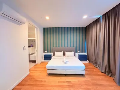 a bedroom with a white bed in a room at Platinum Kuala Lumpur By NewMoon in Kuala Lumpur