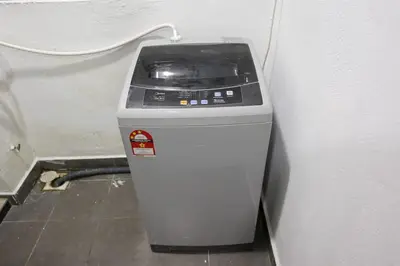 a trash can sitting next to a wall at One Maxim Sentul By LuxeStay in Kuala Lumpur