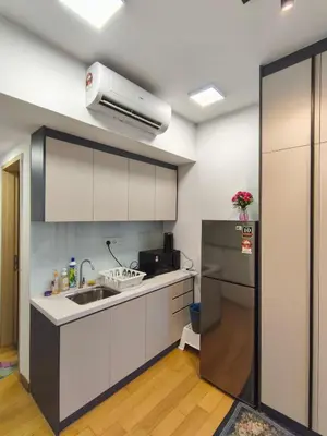 a kitchen with a sink and a refrigerator at Luxe Colony By Urban Haven in Kuala Lumpur