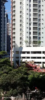a group of tall buildings in a city with trees at Hot Spring Residential in Kuala Lumpur