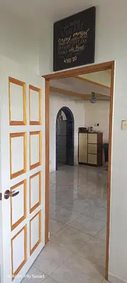 a room with a door with a sign on the wall at Hot Spring Residential in Kuala Lumpur