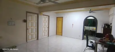 an empty room with a yellow door and a kitchen at Hot Spring Residential in Kuala Lumpur