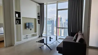 a living room with a couch and a large window at Platinum Executive Suites Kuala Lumpur in Kuala Lumpur