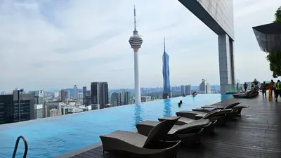 a swimming pool on the roof of a building with a city at Platinum Executive Suites Kuala Lumpur in Kuala Lumpur