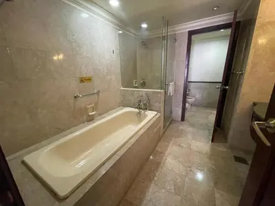 a bathroom with a tub and a shower and a toilet at Kuala Lumpur City Apartment Times Square in Kuala Lumpur