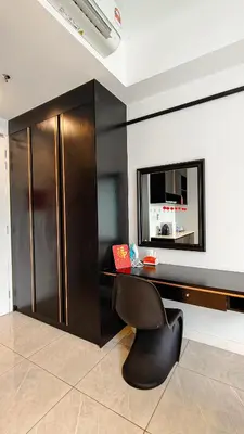 a office with a black desk and a chair at Axon Residence Bukit Bintang by Mia in Kuala Lumpur