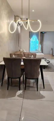 a dining room with a table and chairs at City Suites At Quill Residence KL in Kuala Lumpur