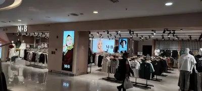 a clothing store with clothes on display in a mall at City Suites At Quill Residence KL in Kuala Lumpur