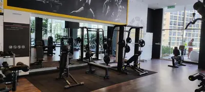 a gym with several rows of treadmills and machines at City Suites At Quill Residence KL in Kuala Lumpur