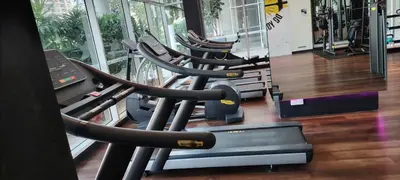 a row of cardio machines in a gym at City Suites At Quill Residence KL in Kuala Lumpur