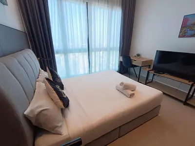 a hotel room with a bed with a teddy bear on it at The Wisma INFINITUM BY KL in Kuala Lumpur