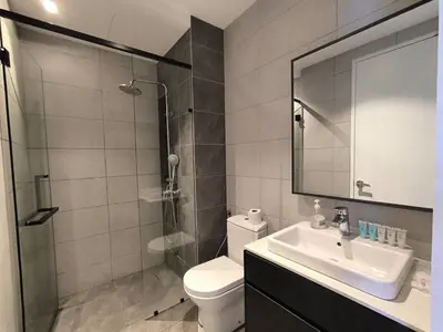 a bathroom with a toilet and a sink and a shower at The Bukit Bintang Near pavilion Axon Residence KL in Kuala Lumpur