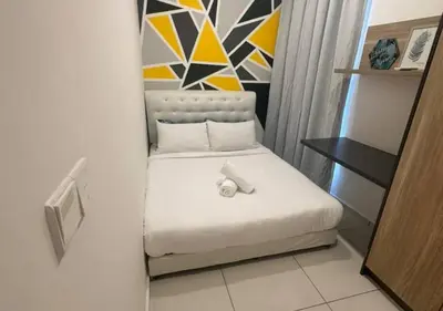 a small bedroom with a white bed in a room at Robertson By Sahara Urban Oasis in Kuala Lumpur