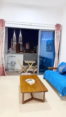 a bedroom with a bed and a view of a city at Colony Luxe By Swift Homes in Kuala Lumpur
