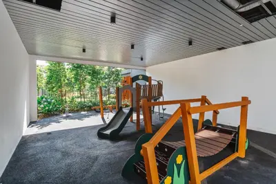 a play room with a playground with a slide at Earthy 2BR @ Agile BB | Wi-Fi + Netflix in Kuala Lumpur