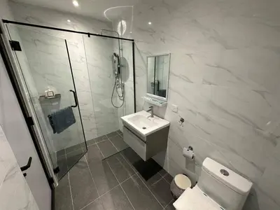 a bathroom with a shower and a toilet and a sink at My Kamar Kamar in Kuala Lumpur
