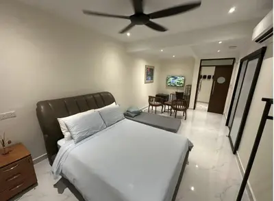 a bedroom with a bed with a ceiling fan at My Kamar Kamar in Kuala Lumpur
