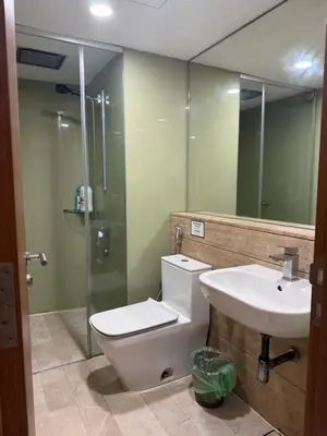 a bathroom with a toilet and a sink and a shower at Vortex KLCC in Kuala Lumpur