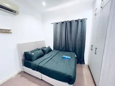 a bedroom with a bed with a black curtain at 9 Min KLCC 9KM Mid Valley Karaoke 30Pax 7Car in Kuala Lumpur