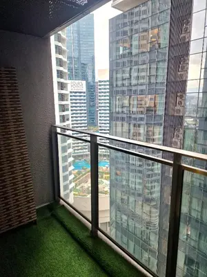 a balcony in a building with a view of a city at Summer suites klcc by Amna in Kuala Lumpur
