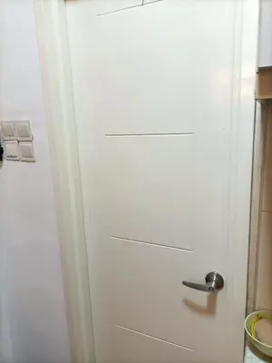 a white door with a handle in a kitchen at Cozy Suite City Central in Kuala Lumpur
