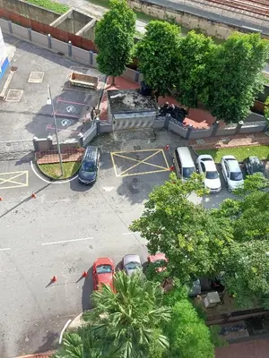 an overhead view of a parking lot with cars parked at Cozy Suite City Central in Kuala Lumpur