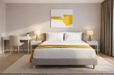 a bedroom with a bed and two tables and a desk at Trion Kuala Lumpur in Kuala Lumpur