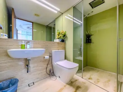 a bathroom with a toilet and a sink and a shower at VORTEX SUITES KLCC By SKYLINE in Kuala Lumpur