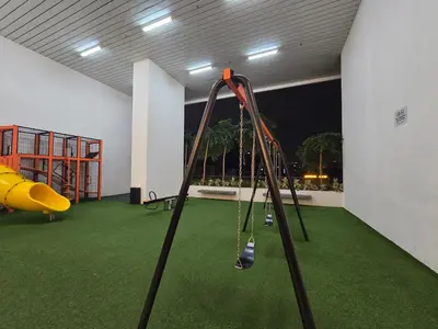 a play room with a slide and a playground at KLCC SERVICED Suites CHAMBERS in Kuala Lumpur